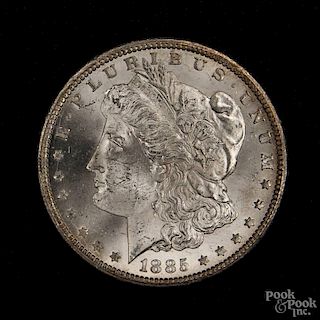 Silver Morgan dollar coin, 1885 CC, MS-63 to MS-64.