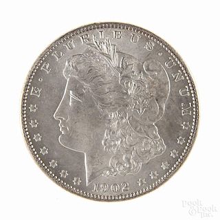 Silver Morgan dollar coin, 1902 O, MS-63 to MS-64.