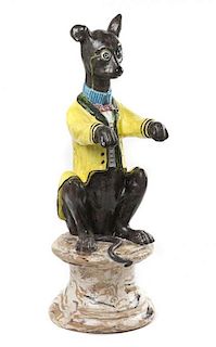 A Majolica Figure of a Seated Whippet, Height 27 1/8 inches.