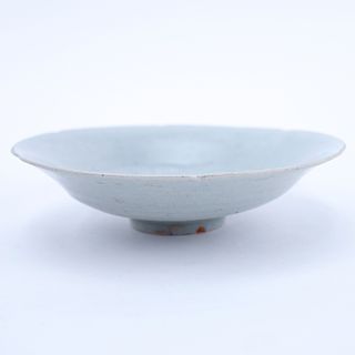 Chinese Song Dynasty (1127–1279) Oingbai Ware Dish. A lobed dish with a central combed peony blossom filling the well covered with pale bluish-green g