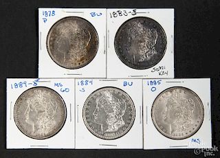 Five silver Morgan dollar coins, to include an 1878, an 1883 S, an 1884 S, an 1885 O, and an 1889 S,