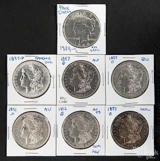 Six silver Morgan dollars, to include an 1891 S, an 1897, three 1897 O, and a 1902 S, together with