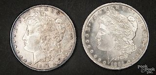 Two silver Morgan dollar coins, 1891 CC, AU-UNC.