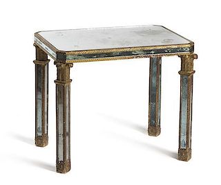 An Italian Gilt and Mirrored Side Table, Height 22 1/4 x width 26 1/2 x depth 18 1/4 inches.