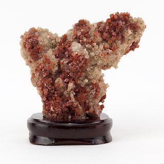 Vanadinite Mineral Specimen on Wooden Stand. Sphered structure with faceted crystals, pale and dark