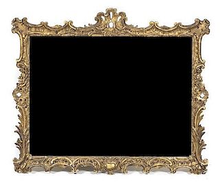 An Italian Baroque Giltwood Mirror, 50 1/4 x 59 1/4 inches.