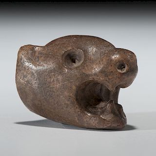 A Mississippian Wolf Effigy Pipe