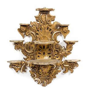 A Continental Baroque Style Giltwood Hanging Etagere, Height 33 1/2 inches.