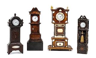 Four Miniature Tall Case Clocks Height of tallest 13 inches