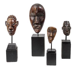 Eight Miniature Carved Wood African Masks Height of largest 8 1/2 inches