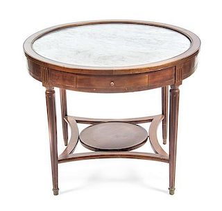 A Louis XVI Style Mahogany Gueridon, Height 28 3/8 x diameter of top 35 1/8 inches.