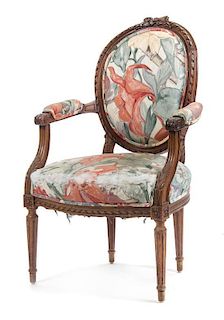 A Louis XVI Style Walnut Fauteuil, Height 37 inches.