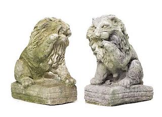 A Pair of Cast Stone Garden Lions, Height 9 1/2 inches.