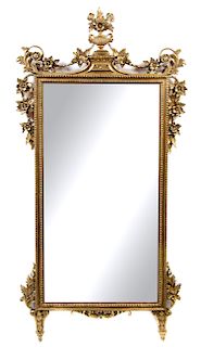 An Italian Giltwood Mirror Height 55 x width 27 1/2 inches.