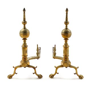 A Pair of Brass Steeple Top Andirons Height 26 inches.