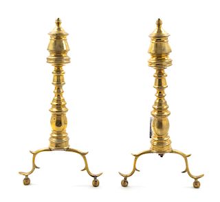 A Pair of William and Mary Brass Andirons Height 19 1/2 inches.
