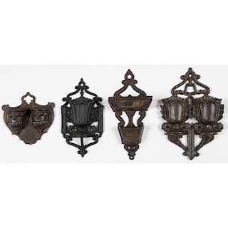 Four Cast-Iron Match Holders with Scalloped Pockets