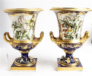* A Pair of Continental Porcelain Urns Height 12 1/2 inches.
