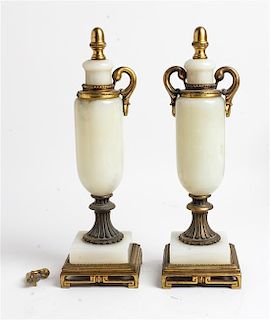 * A Pair of Gilt Metal and Onyx Ornaments Height 13 inches.