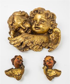 * Three Giltwood Putto Masks Height of tallest 12 inches.