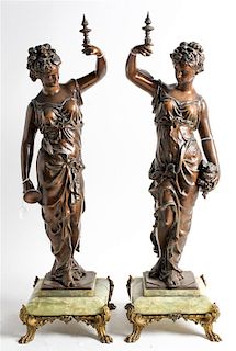 A Pair of Continental Cast Metal and Onyx Figures Height 28 inches.