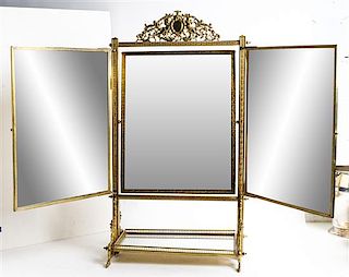 A Neoclassical Style Brass Three-Panel Dressing Mirror Height 29 inches.