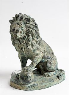 A Cast Metal Lion Figure Height 9 1/2 inches.
