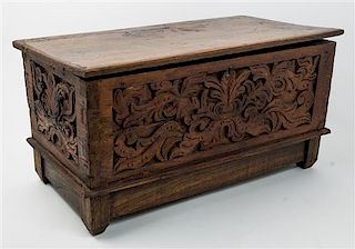 A Dutch Colonial Carved Campaign Chest Height 14 x width 25 1/2 x depth 13 inches.