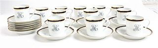 A Set of Twelve Limoges Porcelain Espresso Cups and Saucers Diameter of saucer 4 inches.