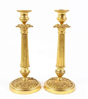 * A Pair of Empire Style Gilt Metal Candlesticks Height 11 1/4 inches.