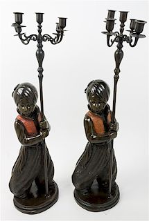 * A Pair of Cast Metal Figural Candelabra Height overall 31 inches.