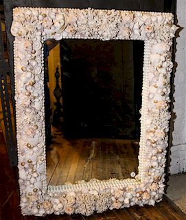 * A Grotto Style Shell Decorated Mirror Height 40 x width 30 inches.