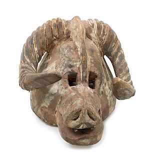 * A Bobo-Fing Wood Ram's Head Mask Height 17 1/2 inches.