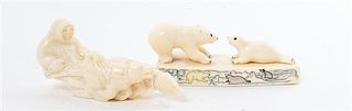 A Pair of Walrus Tusk Figures Length of longest 5 inches.