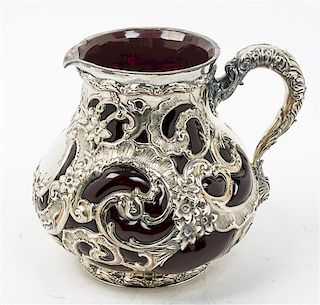 * An American Silver Mounted Glass Water Pitcher, Whiting Mfg. Co., New York, NY, the silver liner worked with openwork floral,