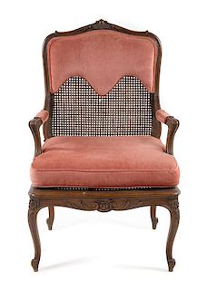 * A Louis XV Style Caned Fauteuil Height 41 inches.