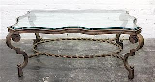 * A Wrought Iron and Glass Low Table Height 19 5/8 x width 50 1/2 x depth 22 3/4 inches.