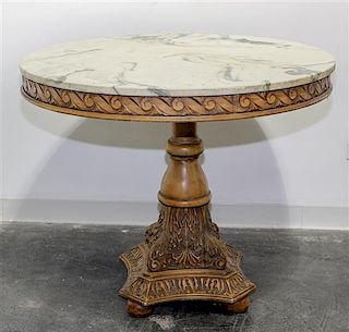 * A Neoclassical Style Carved Breakfast Table Height 31 x diameter of top 36 inches.