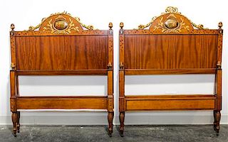 * A Pair of Italian Painted and Parcel Gilt Walnut Twin Beds Height 49 x width 39 1/2 x depth 82 inches.