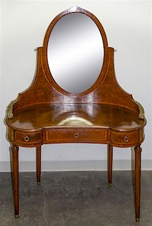 A Burlwood Mother-of-Pearl Inlaid and Gilt Metal Mounted Dressing Table Height 64 1/4 x width 44 x depth 20 inches.
