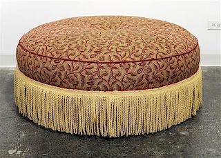 An Upholstered Ottoman Diameter 41 1/2 inches.