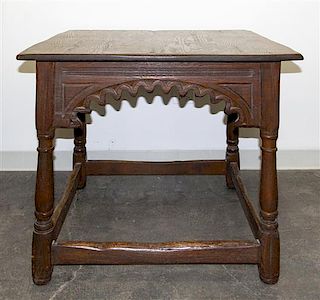 A Gothic Revival Oak Center Table Height 30 1/4 x width 36 x depth 36 inches.