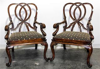 A Pair of Walnut Open Arm Chairs Height 42 inches.