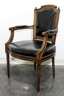 * A Leather Upholstered Open Arm Chair Height 38 inches.