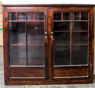 An American Oak Bookcase Height 54 1/4 x width 62 x depth 16 inches.