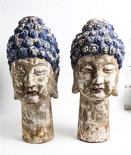 A Pair of Southeast Asian Painted Wood Heads of Buddha Height 25 inches.