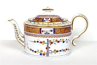 A Spode Porcelain Teapot of Oval Form, Width over handle 10 1/2 inches.