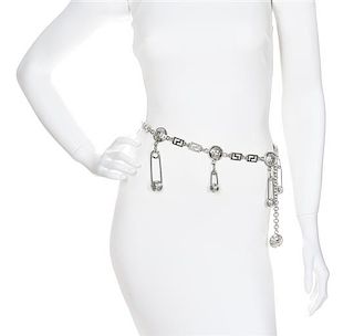 A Gianni Versace Safety Pin and Greco Link Belt,