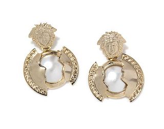 A Pair of Gianni Versace Faux Pearl and Medusa Earclips, 2" x 3".