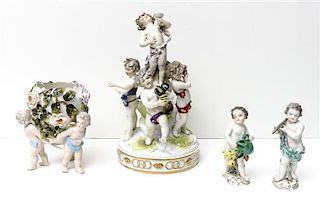 Four Continental Porcelain Figural Groups, Height of centerpiece 9 1/2 inches.